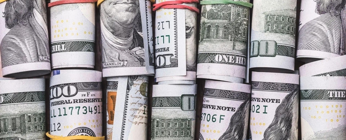image of US dollars rolled up